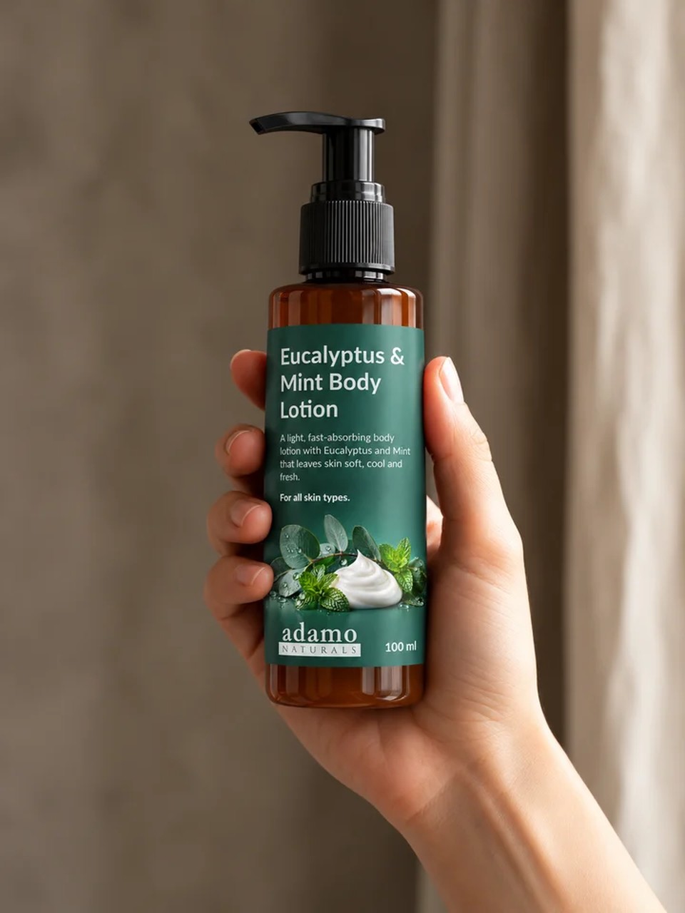 Eucalyptus and Mint Body Lotion 100 ml held in hand - Adamo Naturals
