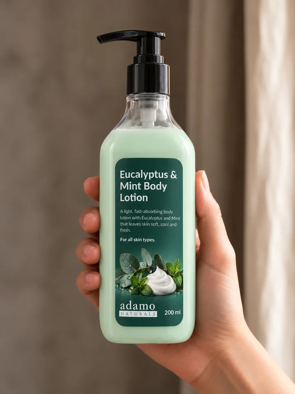 Eucalyptus and Mint Body Lotion 200 ml held in hand - Adamo Naturals