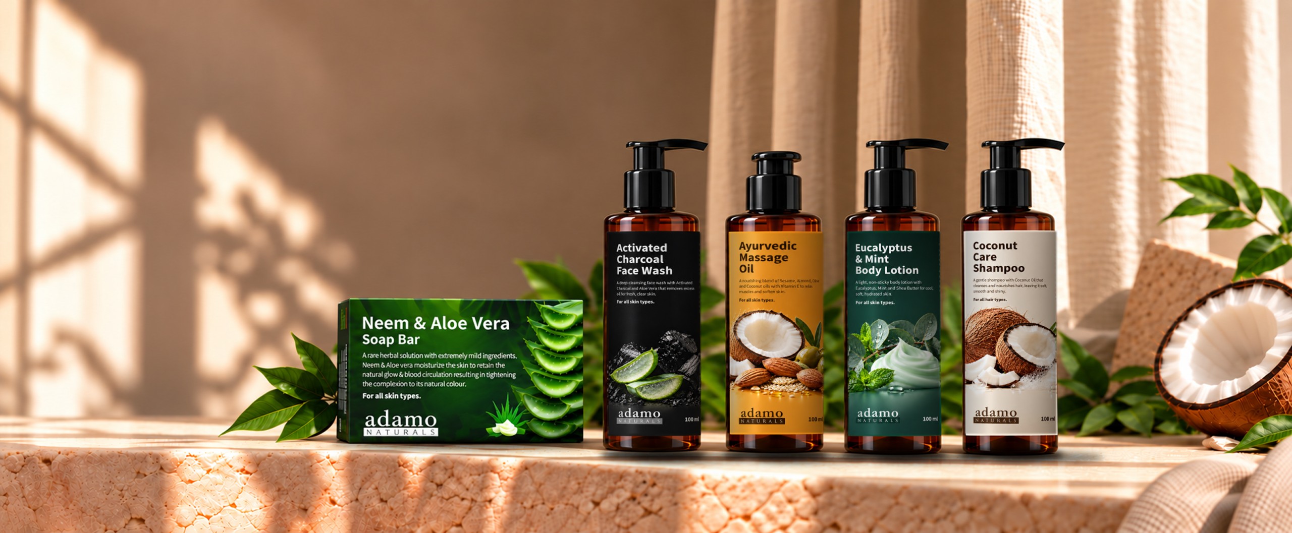 The Adamo Naturals soap, face wash, shampoo, body lotion and massage oil on a stone shelf
