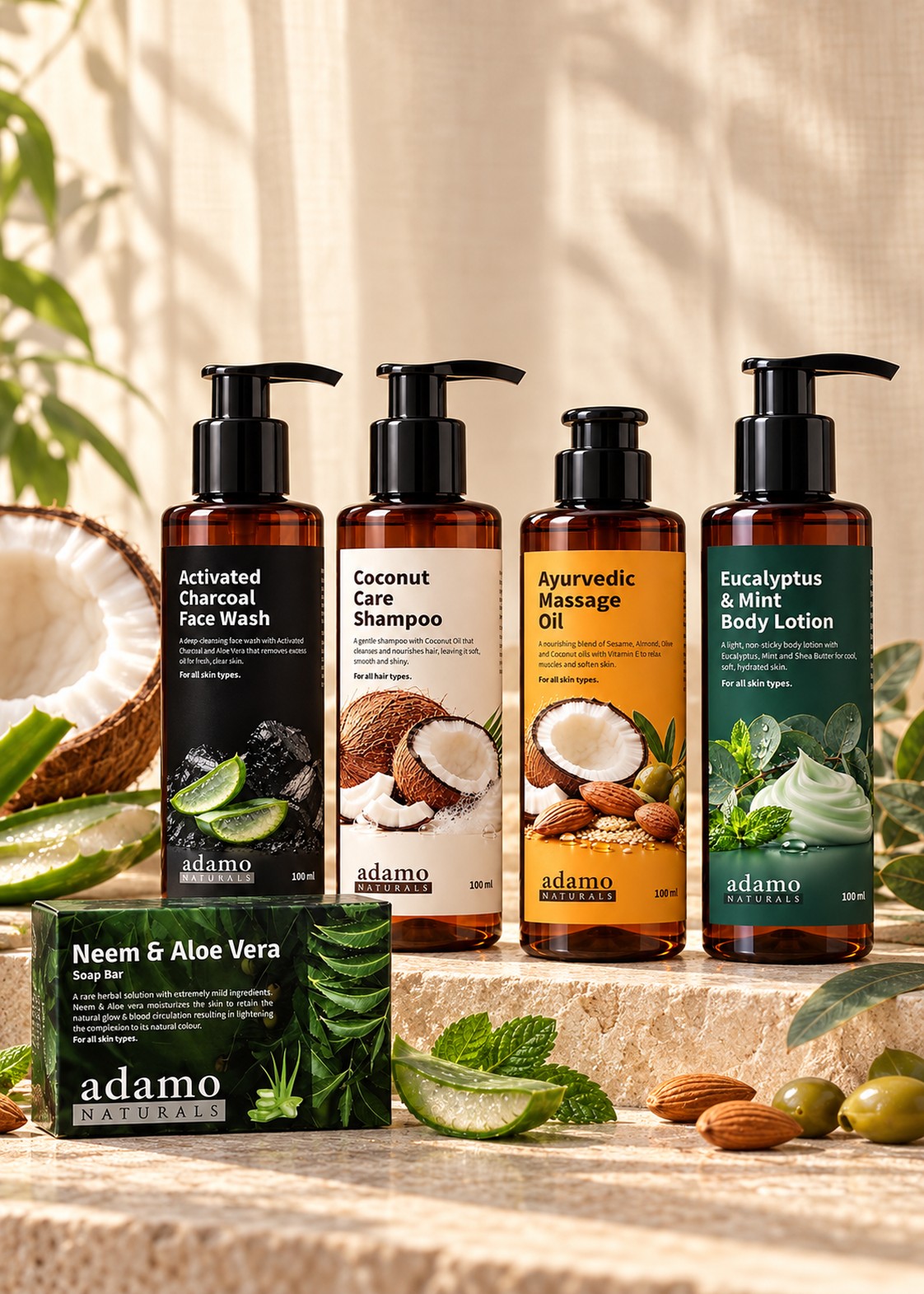 Adamo Naturals face wash, shampoo, massage oil and body lotion on a stone ledge with a Neem and Aloe Vera soap box